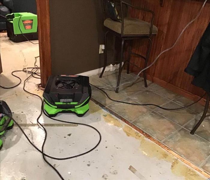 Fans in kitchen on removed flooring