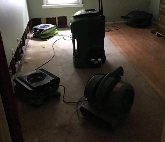 Drying equipment on floor.