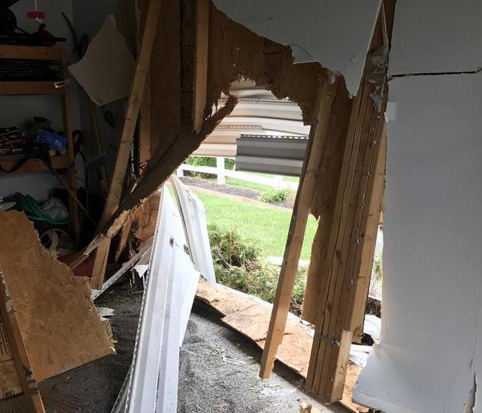 Interior damage to house after car crash