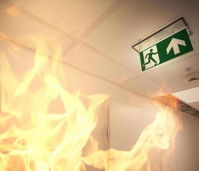 Flames and a fire escape sign.