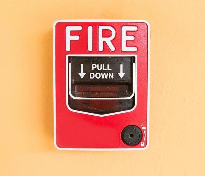 Fire alarm on wall.