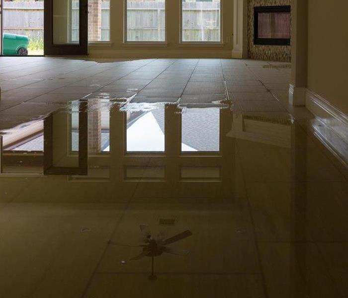 Pool of water on floor.