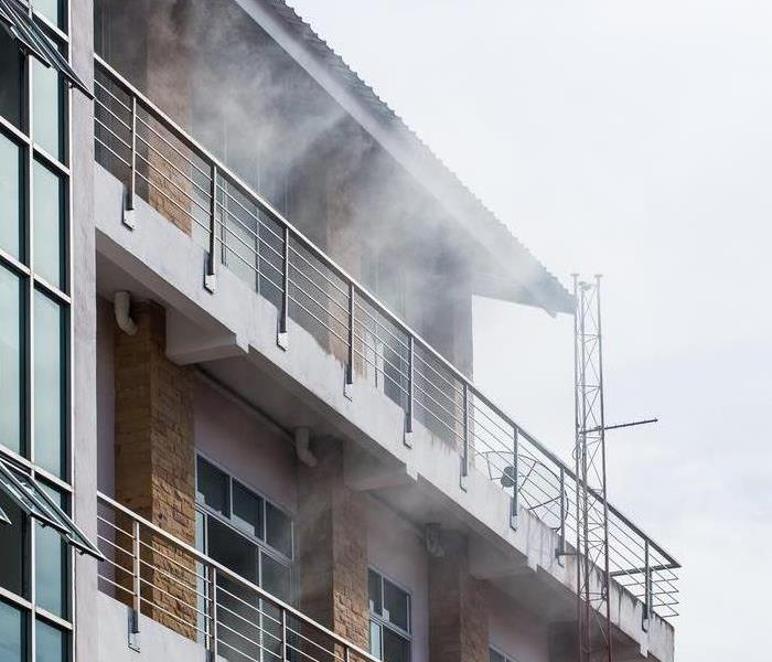 Smoke coming out from a balcony.